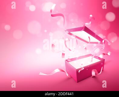 Ribbons bursting out from pink color open gift box Stock Photo