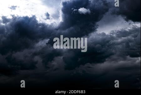 Dark and Dramatic Storm Clouds Area Background Stock Photo
