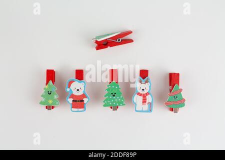 christmas clothespins on white with christmas tree Stock Photo