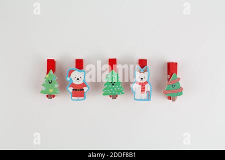 christmas clothespins on white with christmas tree Stock Photo