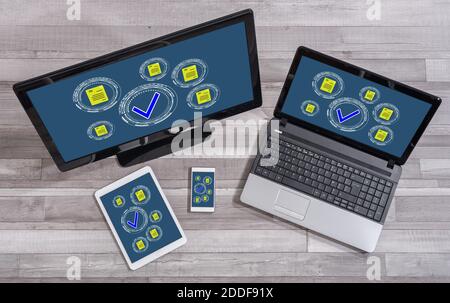 Document validation concept shown on different information technology devices Stock Photo