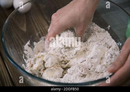 The cook mixes ingredients for apple pie. Ingredients for baking fresh pie. Top view. Toned photo Stock Photo