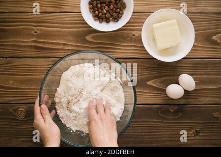 The cook mixes ingredients for apple pie. Ingredients for baking fresh pie. Top view. Toned photo Stock Photo