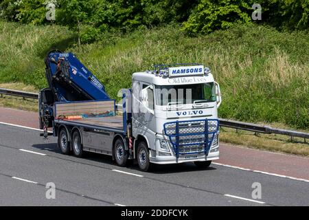 Hamsons 'Old Blue Eyes' illustration; Haulage delivery trucks, lorry, heavy-duty vehicles, transportation, painted truck, decorated cargo carrier, Volvo vehicle, European commercial transport industry HGV, M6 at Manchester, UK Stock Photo