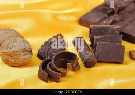 Chocolate, table, pieces, on golden background Stock Photo