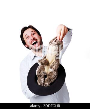 Young businessman with rabbit in hat, funny Stock Photo