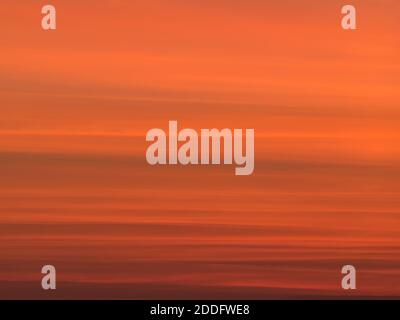 Long exposure picture with the orange sky at sunset. Stock Photo