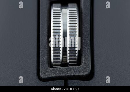 A macro shot of a metal roller from a modern wireless computer mouse. Stock Photo