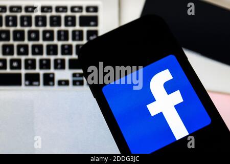 In this photo illustration a Facebook social media app logo seen displayed on a smartphone. Stock Photo