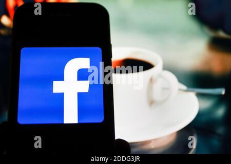 In this photo illustration a Facebook social media app logo seen displayed on a smartphone. Stock Photo