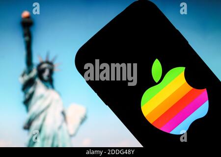 In this photo illustration a Apple company logo seen displayed on a smartphone. Stock Photo