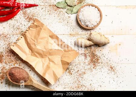 Old paper for recipes  with scattered spices on light background Stock Photo