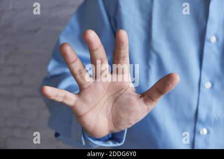 young man show stop sigh close up  Stock Photo