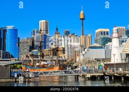 Darling Harbour, Sydney, Australia. In the foreground is a replica of Captain Cook's ship HMS 'Endeavour', with the city skyline behind Stock Photo