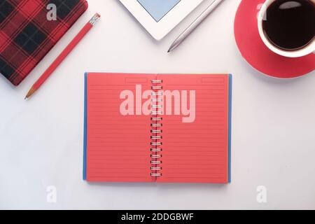open notepad with stationary on white background  Stock Photo