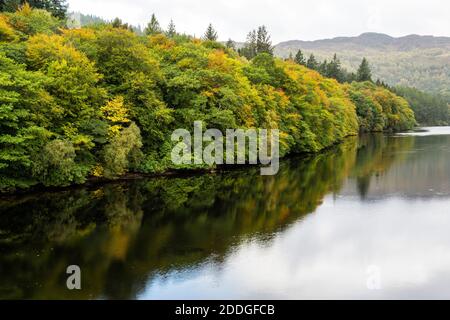 Autumn reflections on Loch Faskally near Pitlochry in Perthshire, Scotland, UK Stock Photo