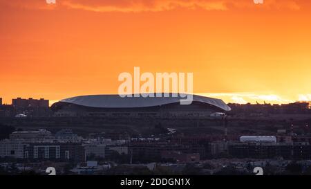 Spectacular view of Wanda Metropolitano Stadium with curved roof on background of orange sundown sky in Madrid Stock Photo