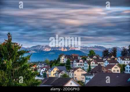Beautiful view from Rüti Switzerland,  small village in front of the alps in zurich oberland Stock Photo