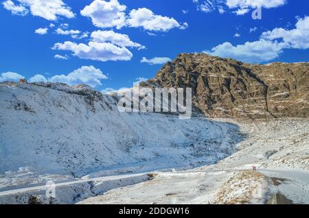 Stunning view of Fagaras mountains in winter. The ridge of the mountain full of snow. There are one of the beautiful road in the world, Transfagarasan Stock Photo