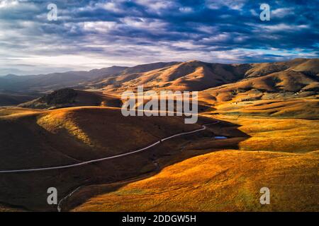 Aerial view of beautiful Zlatibor region landscape with asphalt road passing through from drone pov. Zlatibor is mountain located in south-west Serbia Stock Photo