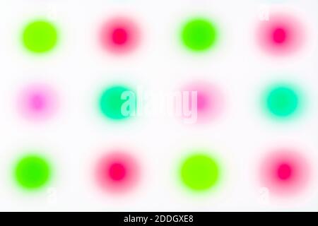 Abstract soft-focus coloured dots.  For lack of clarity, mental illness, not thinking straight, riot of colour, abstract background. Stock Photo