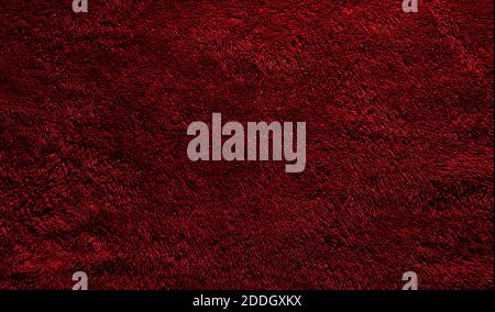A soft red terry towel. Burgundy texture background. Underlay and free space for text. Stock Photo