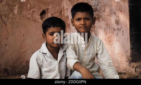 Boys are posing for the camera on a street corner in Bundi, India. Stock Photo