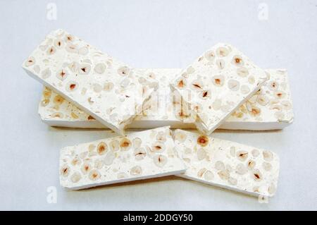 nougat  with hazelnuts from Alba in Piedmont region of Italy isolated on white background Stock Photo