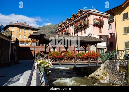 PONTE DI LEGNO, ITALY, SEPTEMBER 9, 2020 - The typical wood bridge with flowers simbol of the town of Ponte di Legno, Brescia province, Italy. Stock Photo