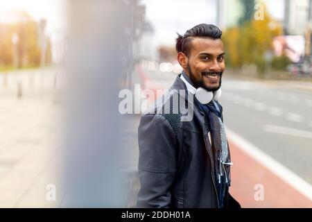 Portrait of a handsome young man on the city street Stock Photo