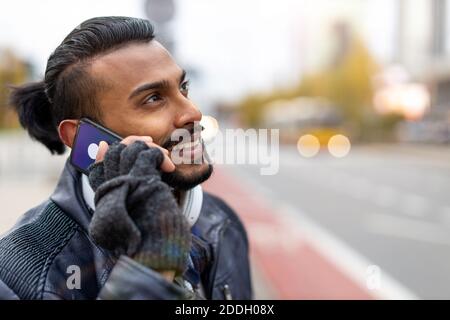 Handsome young man using mobile phone at the street Stock Photo