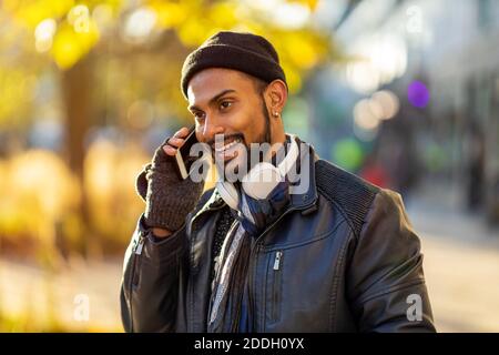 Handsome young man using mobile phone at the street Stock Photo