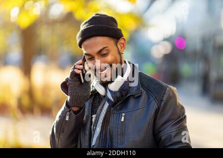 Handsome young man using mobile phone at the street Stock Photo