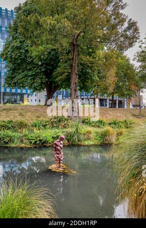 The 2015 Antony Gormley sculpture called Stay. In the Avon River and twin to another at the Arts Centre, Christchurch, New Zealand. Stock Photo