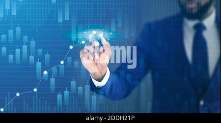 Business growth and economical progress concept. Businessman drawing raising virtual financial chart Stock Photo