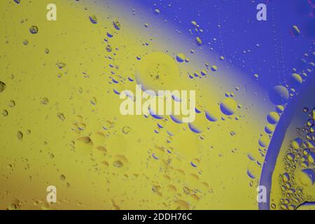 Abstract space and planets universe cosmic background texture. Abstract molecule structure. Water bubbles. Macro shot. Selective focus. Yellow and blu Stock Photo