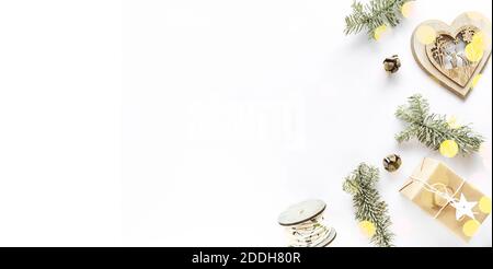 Handmade gift box, holiday decorations, fir branches. Christmas composition on white surface. Christmas DIY present concept. Flat lay, copy space Stock Photo
