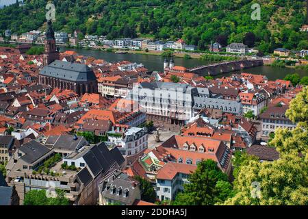 An aerial view from the old castle of central Heidelberg in Baden-Württemberg state, Germany, showing buildings and red rooftops from overhead Stock Photo