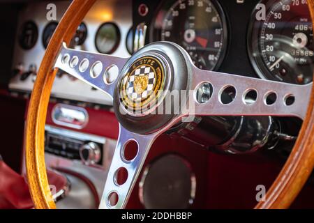 1962 Series 1 E-Type Jaguar. Interior view with steering wheel and instrument panel. Stock Photo