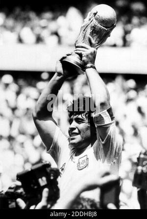 File photo dated 29-06-1986 of Diego Maradona holds up the World Cup after Argentina beat West Germany in the World Cup Final in Mexico. Stock Photo