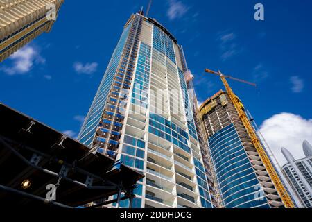 Construction site with tall buildings and cranes Stock Photo