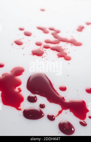 drops of blood, on a white background. view from above drop of blood isolated on white background Stock Photo