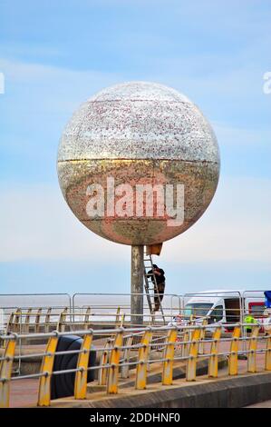 Giant mirror ball on Blackpool seafront is taken down for maintenance and the replacement of the 47,000 mirrors.The six metre diameter 4.5 tonne artwork''they shoot horses don't they?'' will be back on display summer 2021 Stock Photo