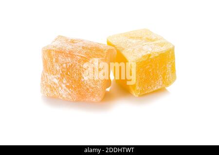 Turkish delight. Honey rahat locum, two pieces of of sweet oriental delights in powered sugar, close-up view. Stock Photo