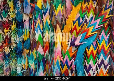 Close-up view of colorful paper cranes sent by children from all over the world close to the Children's Peace Monument, Peace Memorial Park, Hiroshima Stock Photo