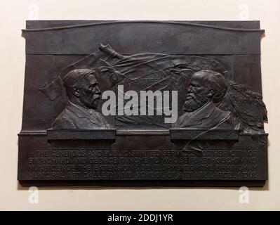 Memorial Tablet of Sir Richard and George Tangye, 1908 Situated on the stairwell in the entrance to the Birmingham Museum and Art Gallery, Chamberlain Square. Richard and George Tangye were engineering manufacturers, patrons of the arts and contributed a large sum to the building of the Museum & Art Gallery, and the Birmingham School of Art on Margaret Street. Sculptor: William Robert Colton Bronze and Marble, 19th Century, Sculpture, Pre-Raphaelite Stock Photo