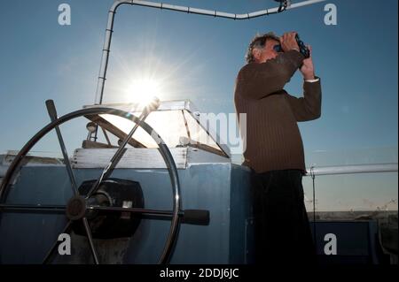 Fisherman looking for fish. Atlantic bluefin tuna fishing. Mediterranean Sea. Stock Photo