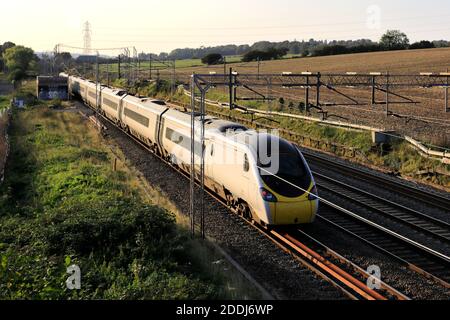 A Pendalino class 390, Avanti West Coast train near Berkhamsted town, West Coast Main Line, Hertfordshire County, England Stock Photo