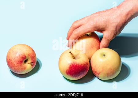 Apples on blue background art image Stock Photo