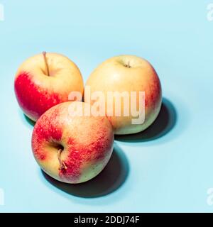 Apples on blue background art image Stock Photo